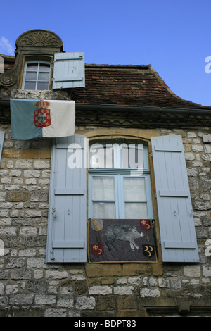 Close up of  a window with blue shutters in the bastide of Monpazier, Dordogne Stock Photo