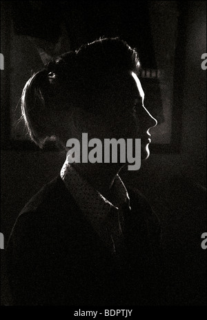 Close up of a young womans face in profile Stock Photo
