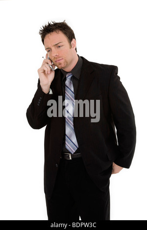 Caucasian businessman standing and talking on the cell phone Stock Photo