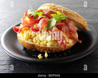 Crispy backon and scrambled eggs on a bagel Stock Photo