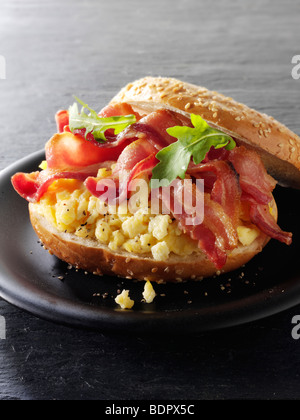 Crispy backon and scrambled eggs on a bagel Stock Photo