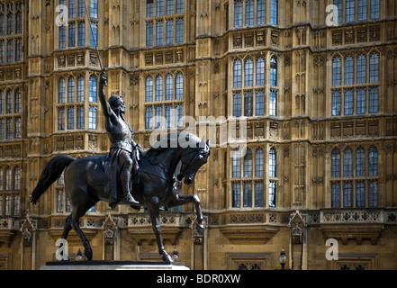 The statue of Richard the Lionheart standing outside the Houses of Parliament in London. Stock Photo