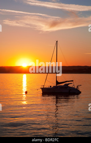 Sunrise and sailboat. Monterey Bay, Caliifornia Stock Photo