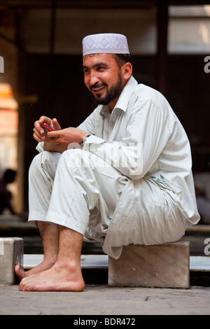 Muslim Man at Ablution Pool in Nakhoda Mosque in Calcutta India Stock Photo