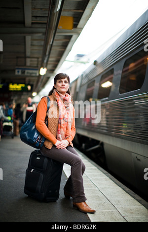 A woman at a railway station Stock Photo