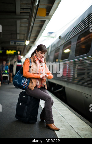 A woman at a railway station Stock Photo