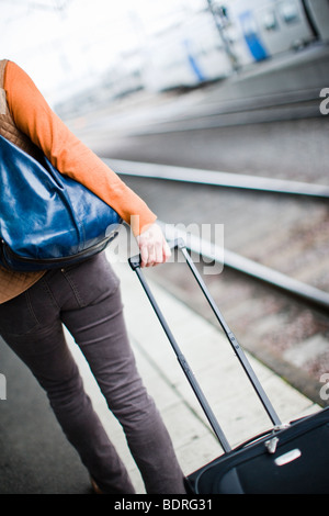 A woman at a railway station Stock Photo