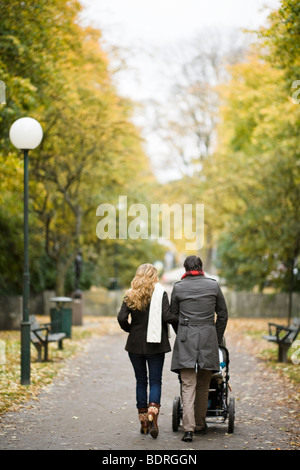 A couple taking a walk with their son Stock Photo