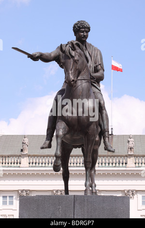 Stanislaw II August Poniatowski statue of the last King of Poland on the Ulica Krakowskie Przedmiescie with Polish flag Stock Photo