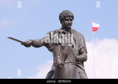 Stanislaw II August Poniatowski statue of the last King of Poland on the Ulica Krakowskie Przedmiescie with Polish flag Stock Photo