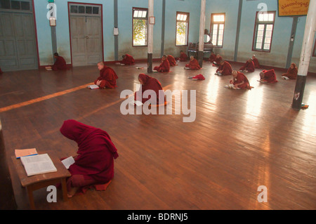 Monks in Prayer Robes at Evening Prayers at Theravada Buddhist Monastery in Kalaw, Shan State near Heho, Myanmar, Burma, Southea Stock Photo