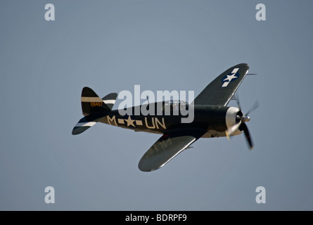 A Republic P-47 Thunderbolt flies at an air show. Stock Photo