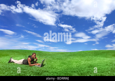 Student Working Outdoors on a Laptop Computers Stock Photo