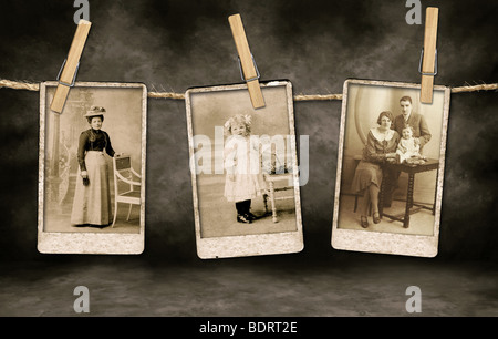 Three Authentic Vintage Family Photographs Hanging on a Rope By Clothespins Stock Photo