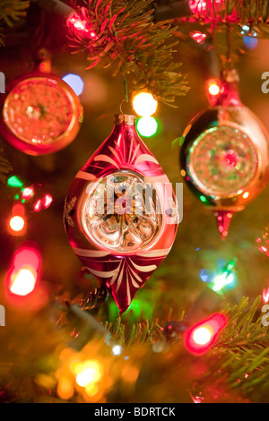 Christmas ornaments and lights on a Christmas tree Stock Photo
