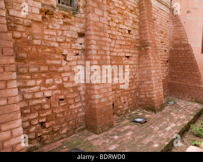 Wall at site of the Jallianwala Bagh Massacre, AKA the Amritsar Massacre, with holes that bullets made in the brick work. India. Stock Photo