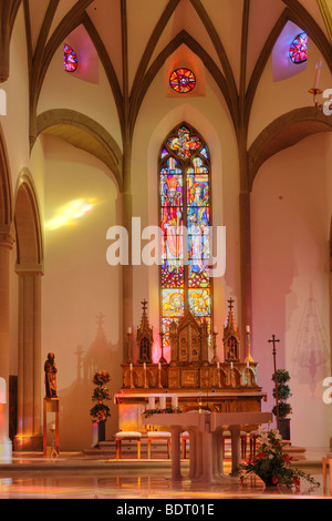 Main altar and stained-glass window in St. Nicholas Cathedral, Feldkirch, Vorarlberg, Austria, Europe Stock Photo