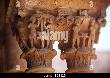 Decorated medieval historicated column capitals in the clositers of Monreale Cathedral - Palermo - Sicily Stock Photo