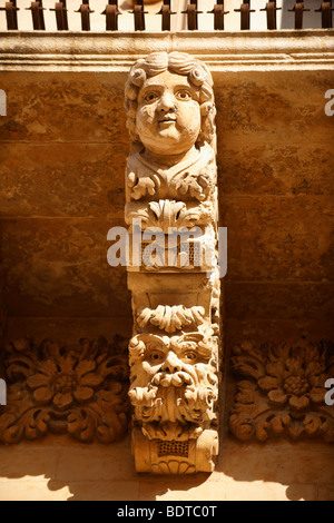 Sculptured Baroque balcony supports -  Palazzo Nicolaci  - Noto - Sicily Stock Photo