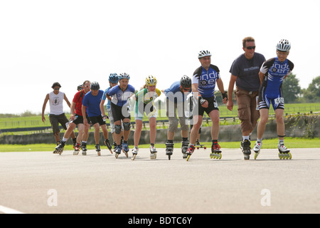 Speed skaters in line racing in a charity race Stock Photo
