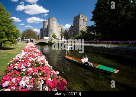 Man Punting Tourists Along The Westgate Gardens On The River Stour in Canterbury ,Kent, UK Stock Photo