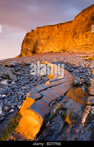 Ledges and cliffs bathed in golden sunlight, Kilve, Somerset, England. Spring (May) 2009 Stock Photo