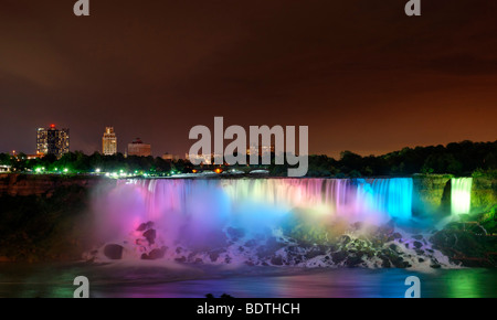 Niagara American Falls and Bridal falls and town behind at night Stock Photo