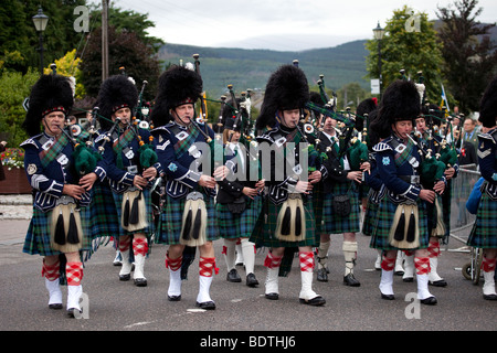 Royal Highland Gathering, Scottish marching pipe band; Games pipers at the Princess Royal and Duke of Fife Memorial Park, Braemar, Aberdeenshire, UK Stock Photo