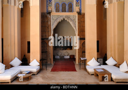 Interior Courtyard with Tables & Art Gallery of Dar Cherifa Restaurant in a late c16th Saadian Riad Marrakesh Morocco Stock Photo
