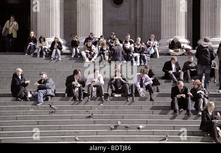 London Life - St Paul's Cathedral steps people eating lunch, UK Stock Photo