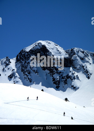Cross country skiers climb a mountain in andorra Stock Photo