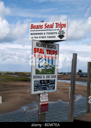 Sign advertising boat trips to view seals at Blakeney Norfolk Stock Photo