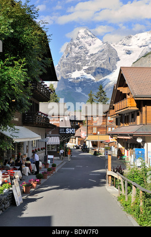 The main road of the car-free mountain village of Muerren, in the back Mt. Eiger, Canton Bern, Switzerland, Europe Stock Photo