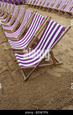 Empty deck chairs on beach England Uk Stock Photo