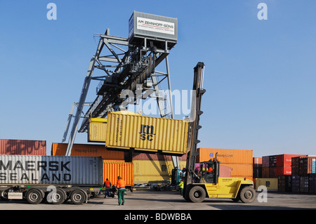 Bonn container terminal, reach stacker setting a container onto a truck ...