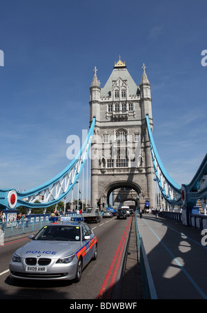 Silver Metropolitan Police car crosses Tower Bridge in Central London, UK Stock Photo