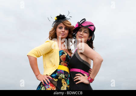 Two attractive young Turkish women at Ascot racecourse, England, UK Stock Photo