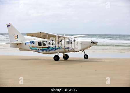 Aircraft taking off on Seventy-Five Mile Beach, an official highway, the world's only official beach airport on a sand runway,  Stock Photo