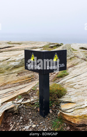 Warning sign for risk of falling on the cliffs of Cornwall, Cornwall, England, UK, Europe Stock Photo