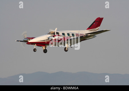 Beechcraft A60 Duke twin-engine light private prop plane on approach Stock Photo