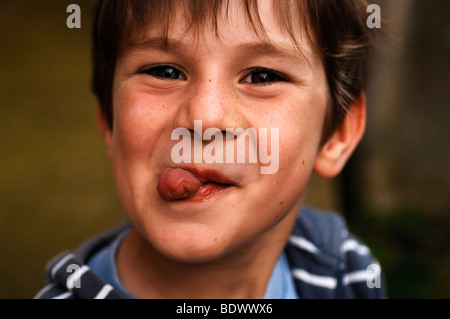 Little boy making faces Stock Photo