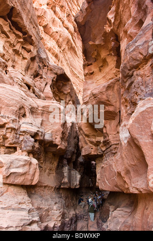 Tourists inside Khazali Canyon in Wadi Rum Jordan Stock Photo