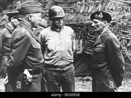 D-DAY 1944 US Generals Patton at left and Bradley meet with Field Marshal Montgomery in France in July 1944.  Description below Stock Photo