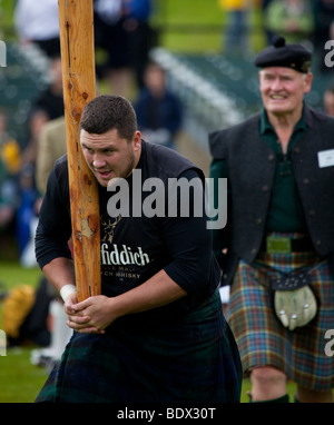 Caber Toss Scottish athletic event  at the Braemar Royal Highland Gathering and Games,  Princess Royal & Duke of Fife Memorial Park, Braemar, Aberdeen Stock Photo