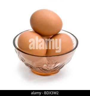 Fresh eggs in bowl isolated on white background Stock Photo