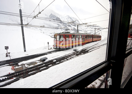 Train station at Kleine Scheidegg which connects to a cog railroad that crosses the Eiger mountain on its way to Jungfraujoch Stock Photo