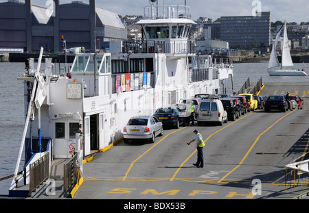 Loading the roro Torpoint ferry which crosses the Tamar River between Torpoint in Cornwall and Devonport Plymouth in Devon UK Stock Photo
