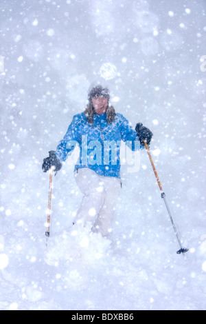 Snowshoe hiking in the village of Leukerbad, a small high alpine village near the southern edge of Switzerland. Stock Photo