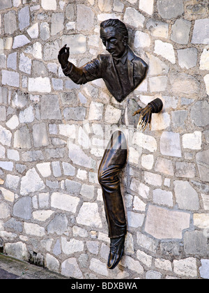 The statue; Le Passe Muraille at Montmartre, Paris, France. Stock Photo