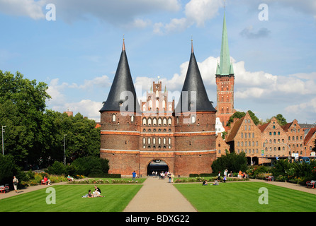 The Holstentor, Holsten Gate, in Luebeck, in the back the church of St. Petri, Schleswig-Holstein, Germany, Europe Stock Photo